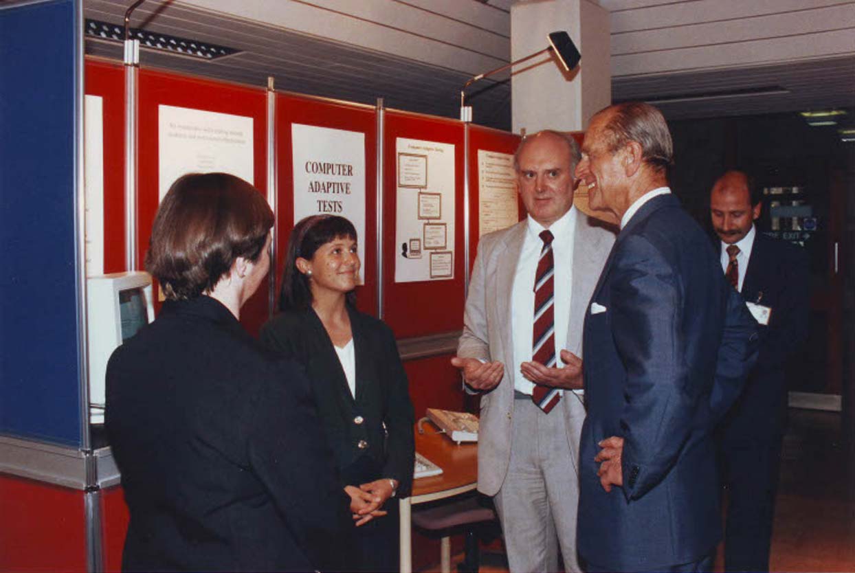 His Late Royal Highness The Duke of Edinburgh chats to staff during a visit to UCLES in 1993
