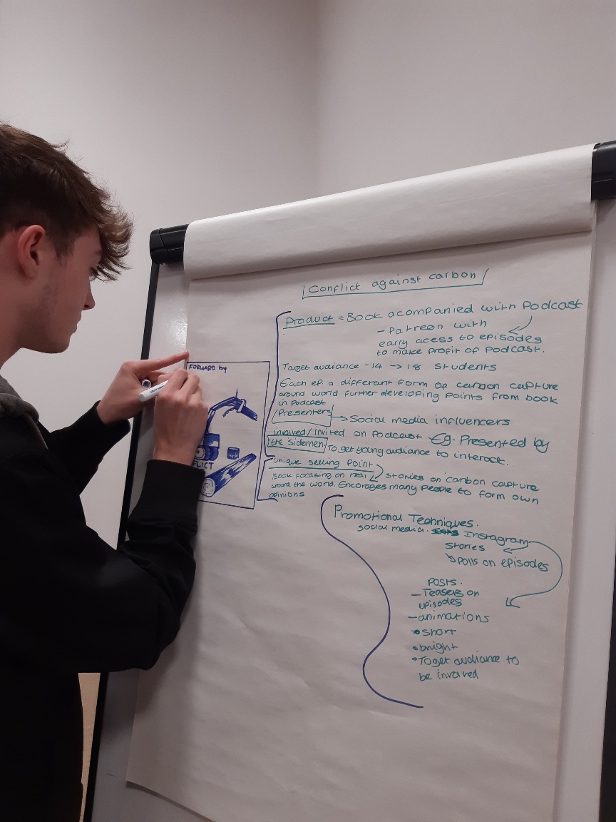 Student writing on board