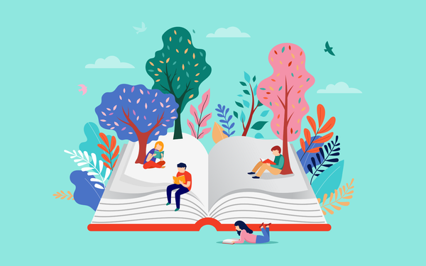 four people on a book reading with trees around them