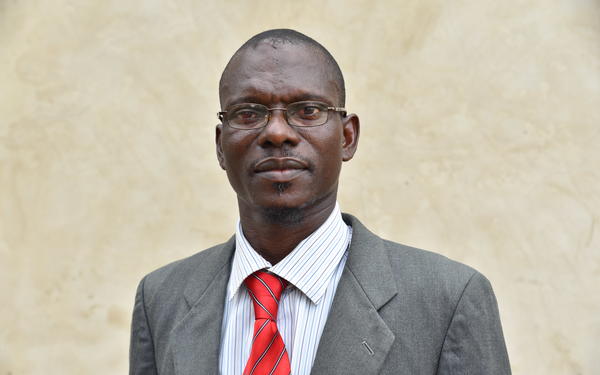 Photo of Akeem Badru smiling at camera