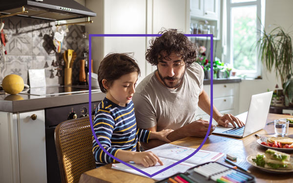 Parent teaching child at home 
