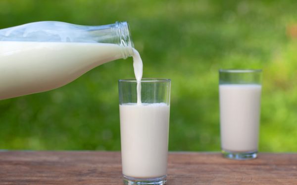 Fresh milk being poured from a bottle to a glass - Source: Getty Images
