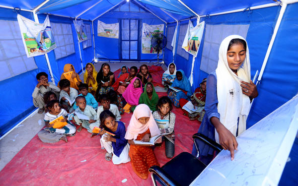 Children study in temporary shelter.