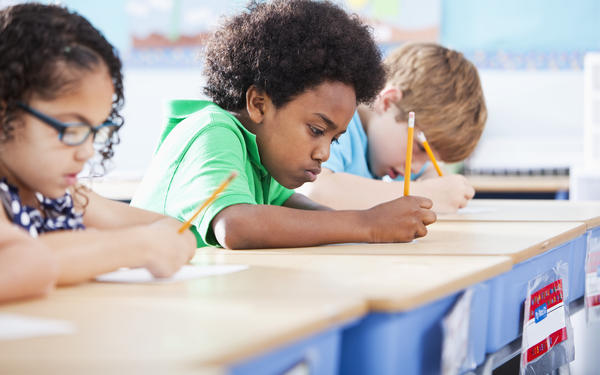 Children studying at desks