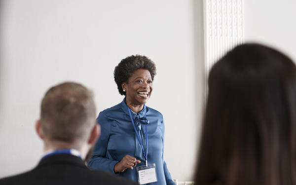 Woman presents to audience