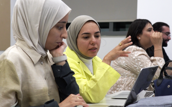 Educators collaborating in a workshop setting, building skills to integrate AI into teaching and learning.