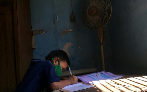 Child writing - Jane Mann comment piece