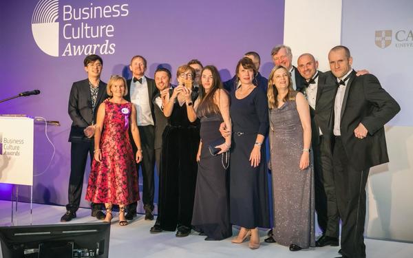 Hosts Phil Wang & Cath Longfield with our team members Guy Nicholson, Martyn Thompson, Janet Scotcher, Damian Sikon, Kirsty Smith, Valentina Ceitlina, Rafal Chatkowski, Heather Darwin, David Bulman, Martin Hemmingfield, Simon Butteriss at the Business Culture Awards ceremony
