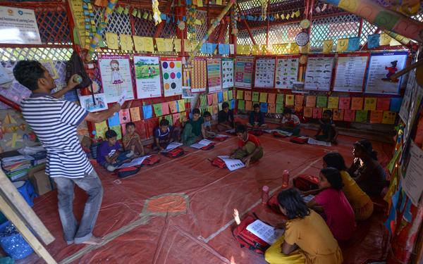 Children learning in a refugee camp