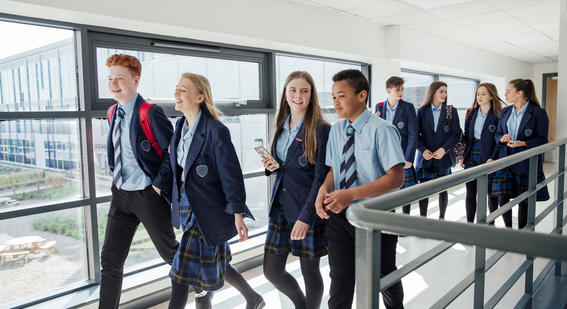 Students walking down a corridor 