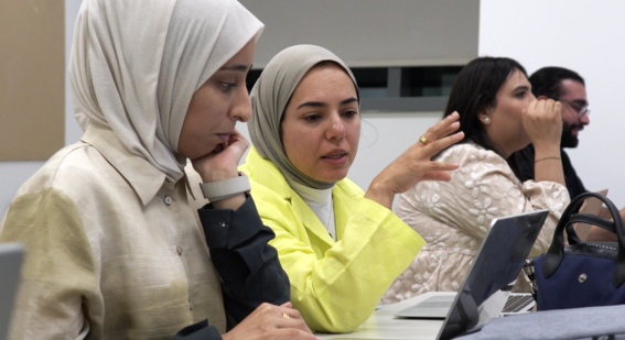 Educators collaborating in a workshop setting, building skills to integrate AI into teaching and learning.